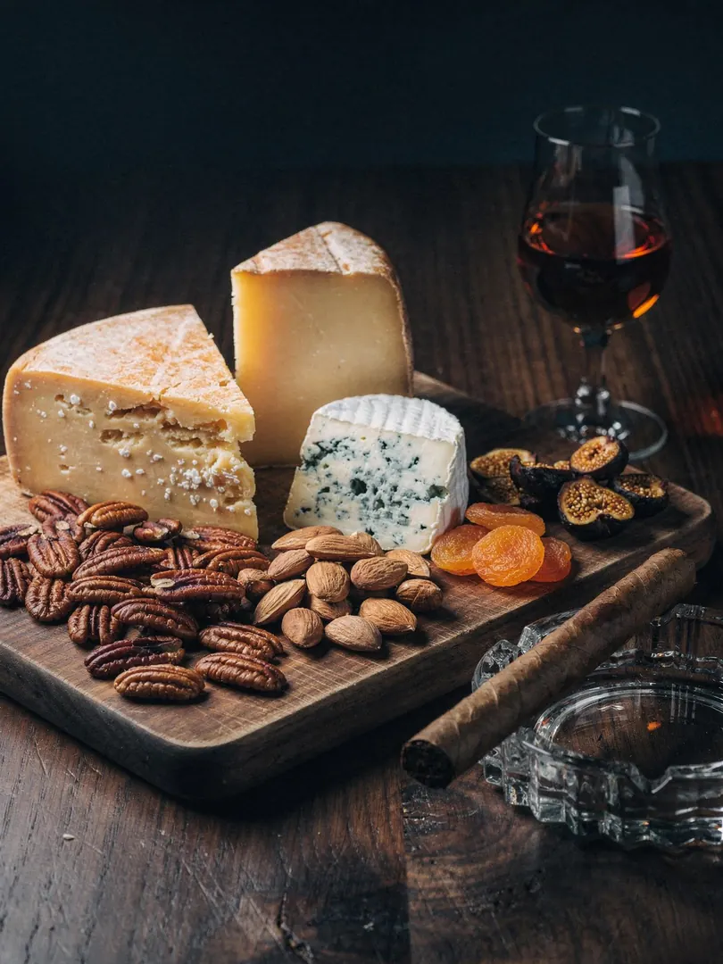 Rum with cheese, nuts, and cigars